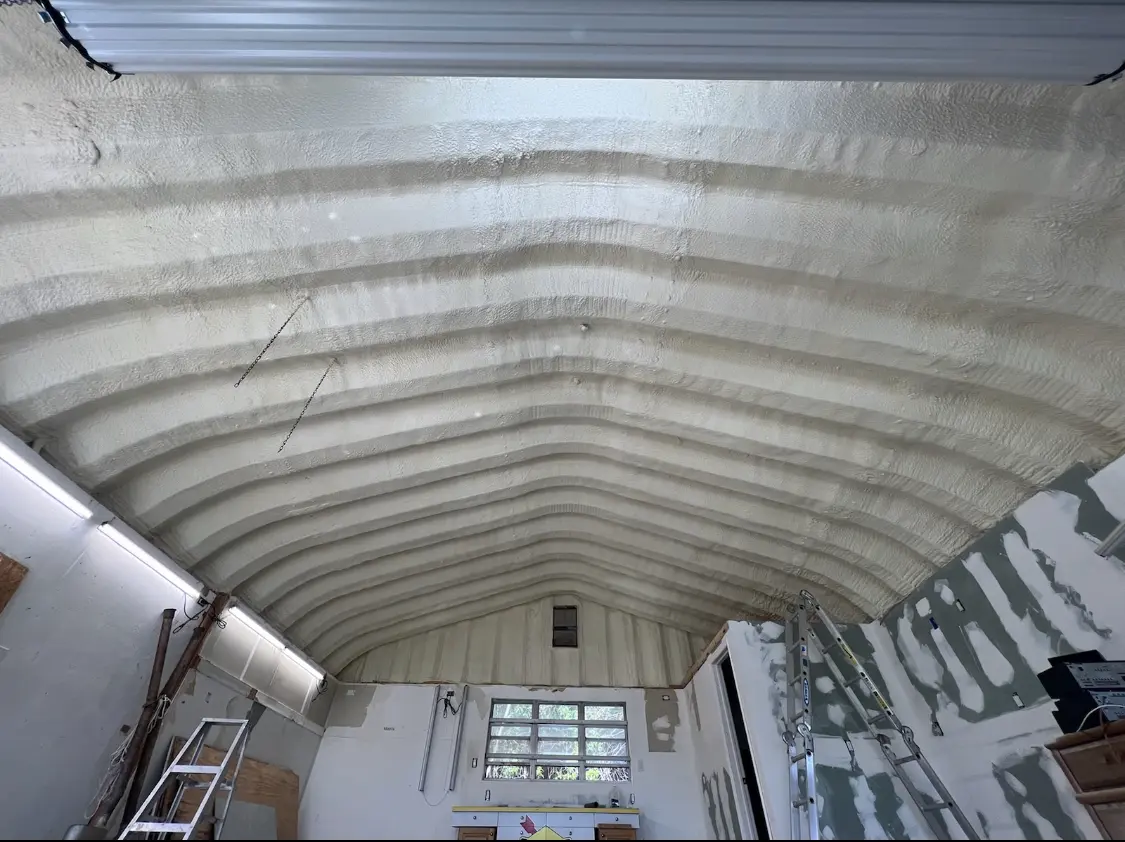 Spray polyurethane foam applied to the underside of a metal roof deck in Spring Arbor